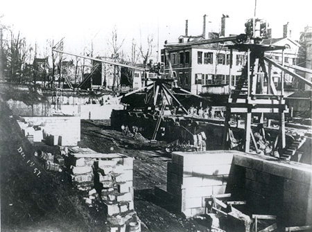 Black and white photograph of construction of the West Wing foundation