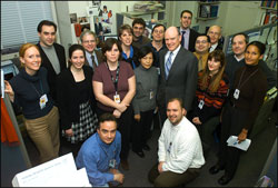 Treasury Secretary John Snow, poses with news correspodents at Treasury's Press Room