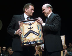 Tom Ridge, Secretary of Homeland Security, recieves the Treasury Customs Flag from Treasury Secretary