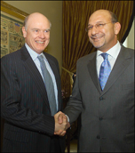 Treasury Secretary John Snow greets South Africa's Finance Minister Trevor Andrew Manuel