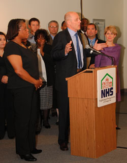 Photo: Secretary Paulson and Regina Garrett, left, a Chicago resident who received assistance though Neighborhood Housing Services, spoke about mortgage counseling services at the agency today.