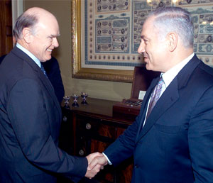 Treasury Secretary John Snow greets Israeli Finance Minister Benjamin Netanyahu.
