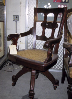 A color photograph of a restored chair in the Treasury collection