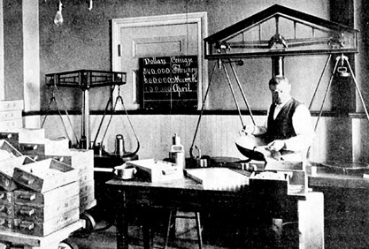 Black and white photograph of bullion scales at the New Orleans Mint